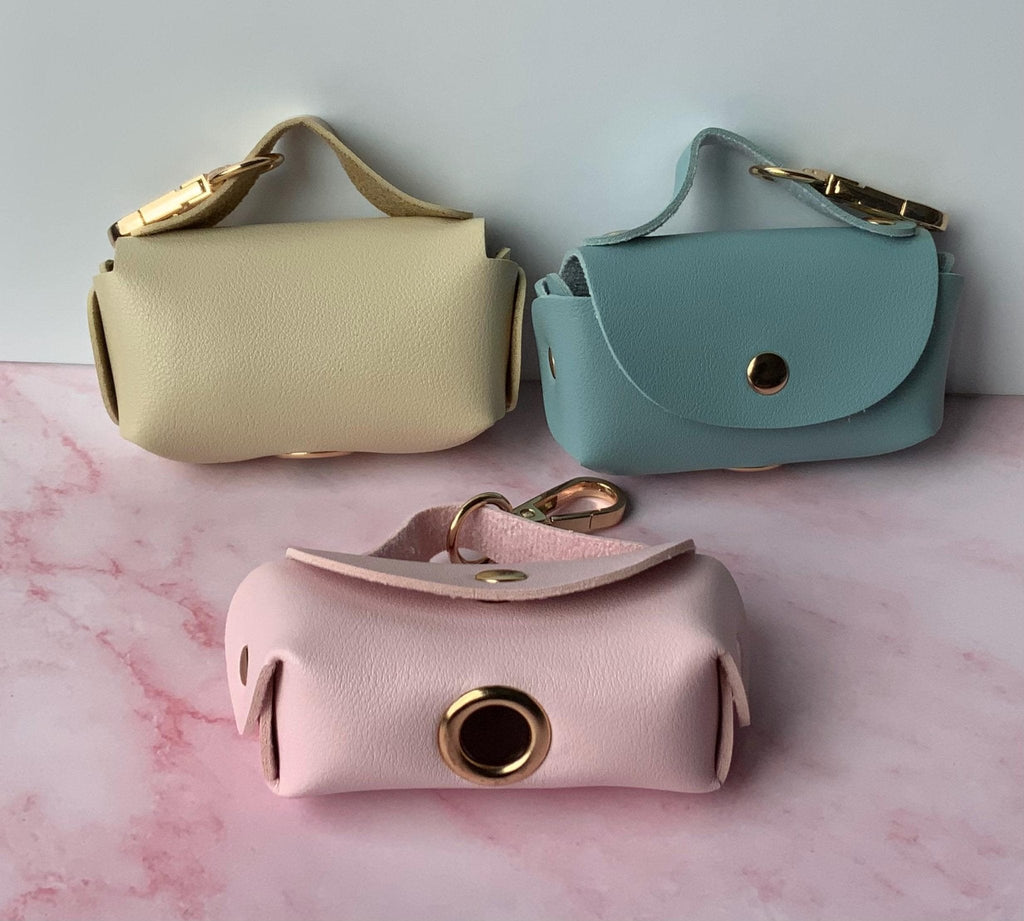 Stylish Pet Waste Organizer Premium Dog Bag Holder Portable Storage Container Leash Attachment System Convenient Roll Dispenser Design Luxury Faux Leather Construction Beautiful Pastel Color Options Essential Walking Companion Practical