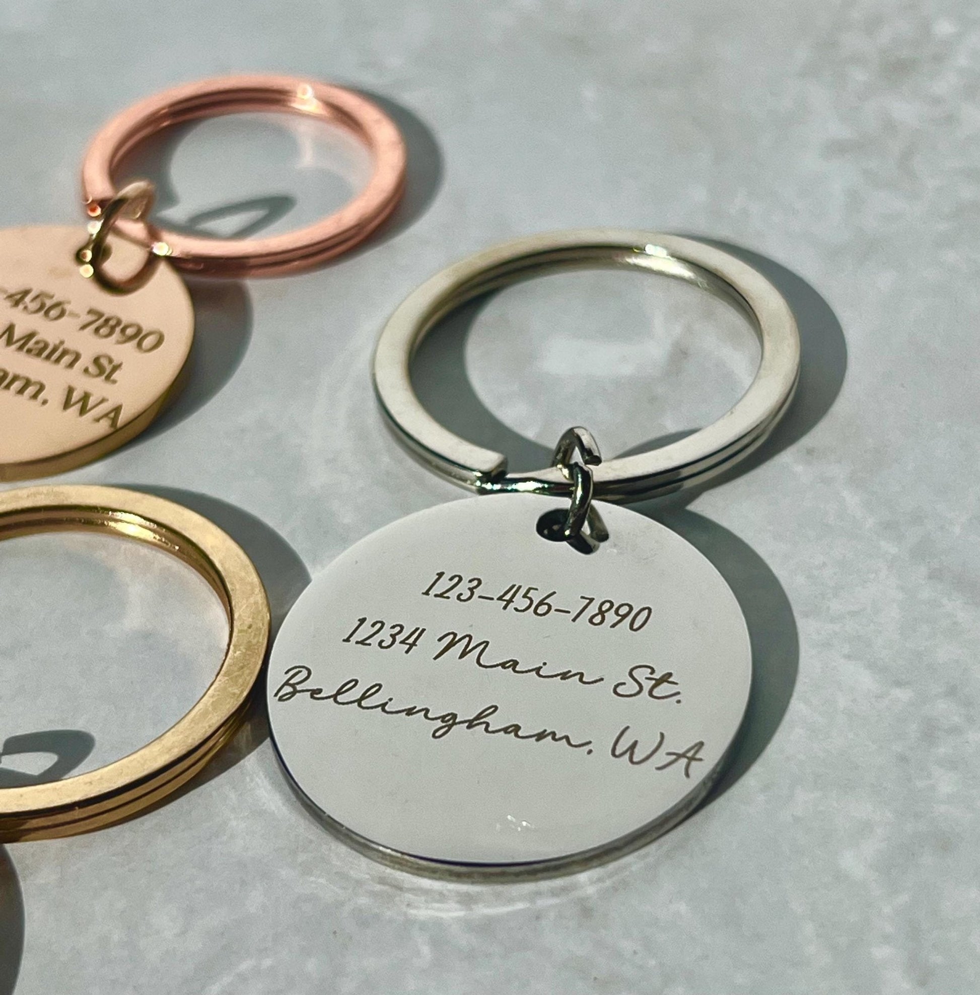 Durable Pet ID Tags Premium Stainless Steel Construction Custom Engraved Design Multiple Sizes Available Double Sided Text Options Dog Cat Identity Protection Personalized Details Collar Attachment Various Colors Essential Pet Care Quality